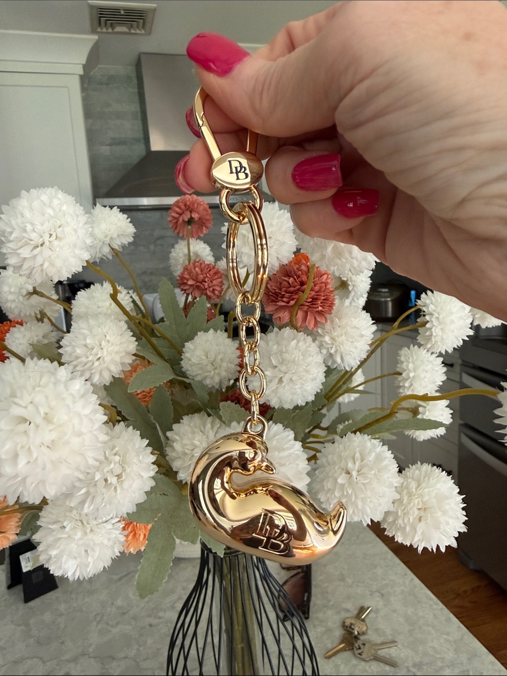 Dooney and Bourke gold, chubby duck bag charm